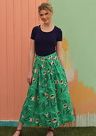 Model wears mint green base floral print cotton midi length skirt