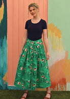 Model wears cotton mint green floral print voluminous midi skirt