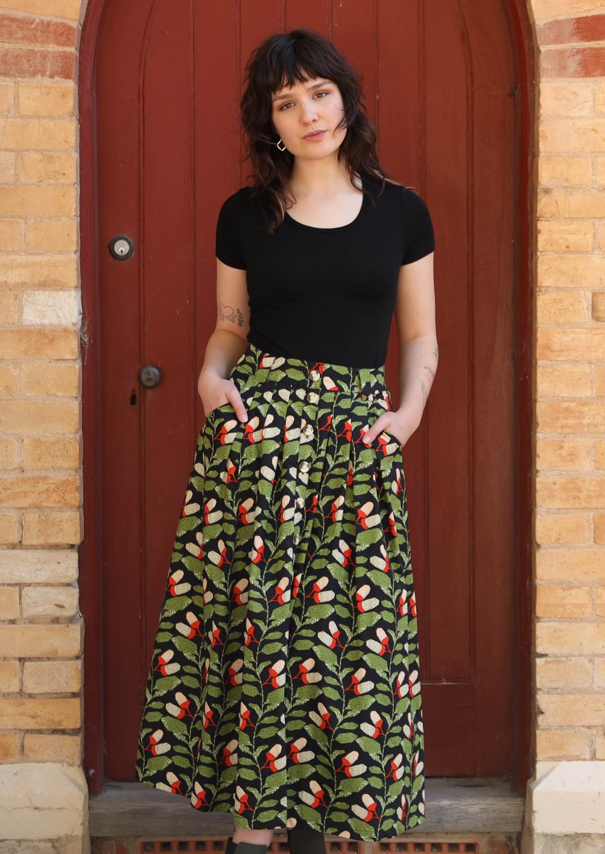 Model wears cotton midi skirt with pockets