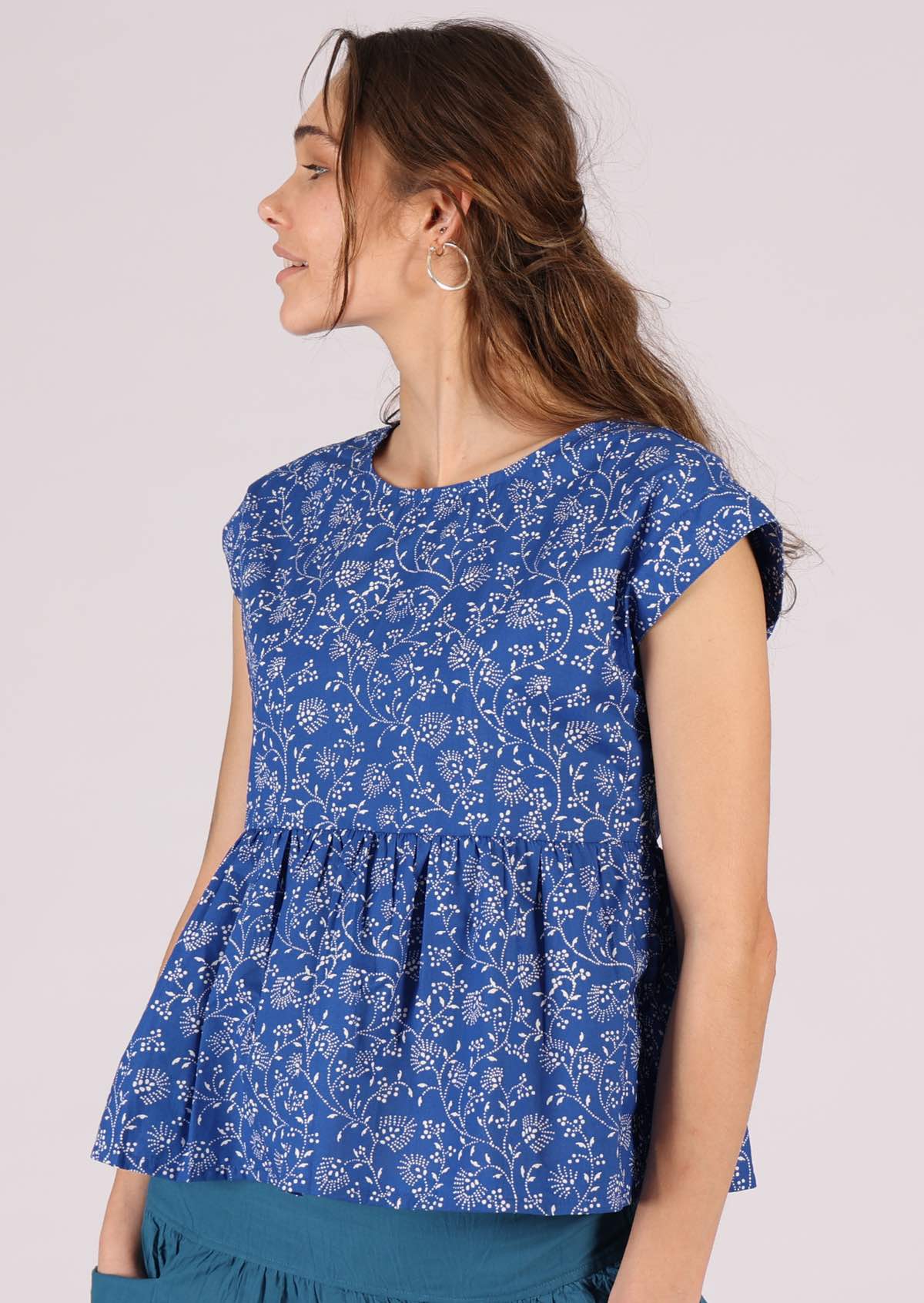 Cap sleeved cotton top with delicate white floral on blue