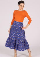 Cotton retro skirt with floral print on blue base has back zip