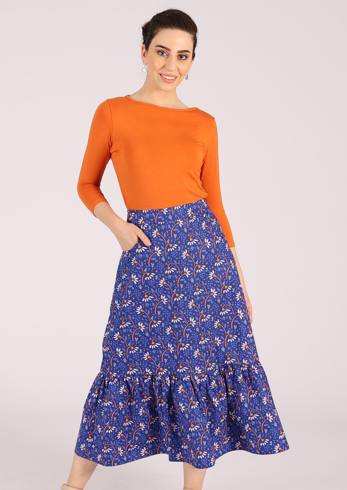 Model wears cotton retro skirt with large ruffle