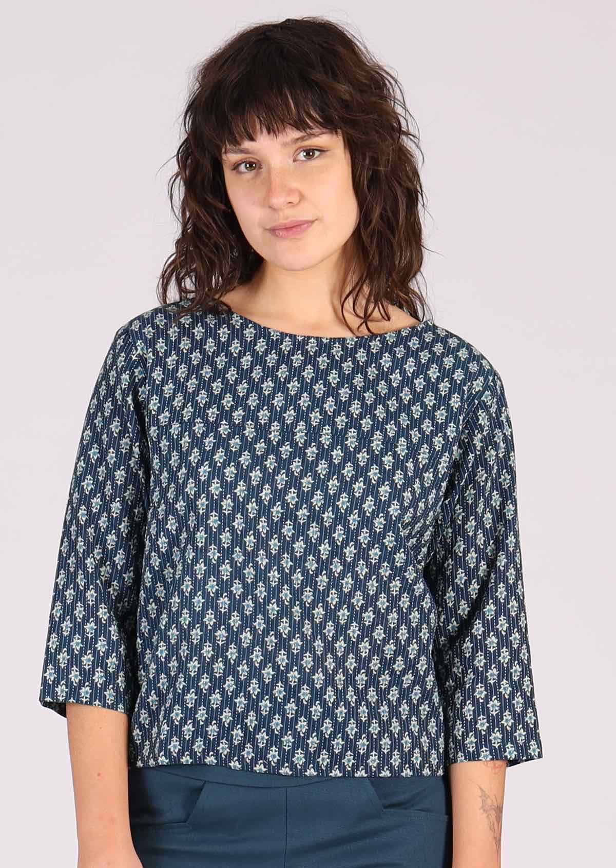 100% cotton top has 3/4 length sleeves. 