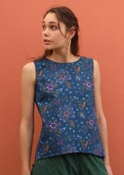Model wears 100% cotton top with a round neckline in blue. 