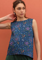 100% cotton top has a subtle concave hem line. 