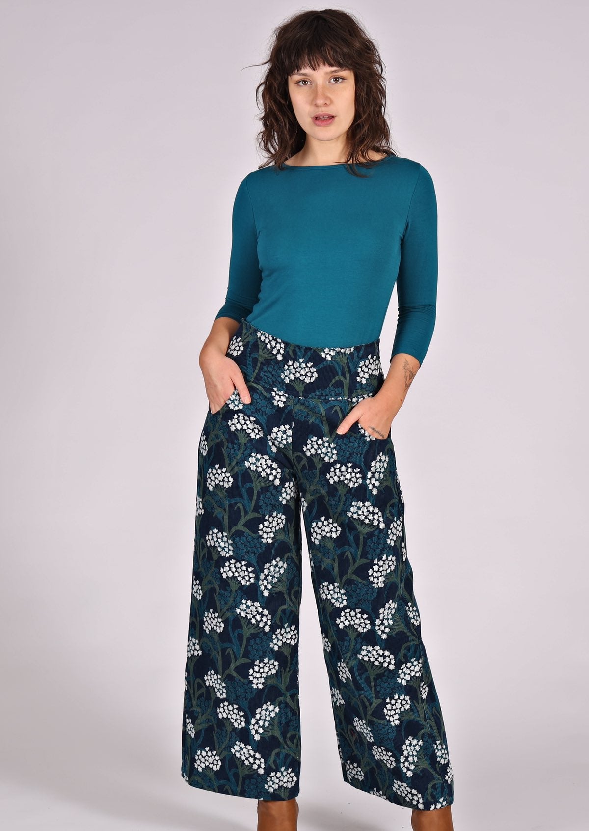 Green and white floral print on blue base cotton corduroy wide leg pants