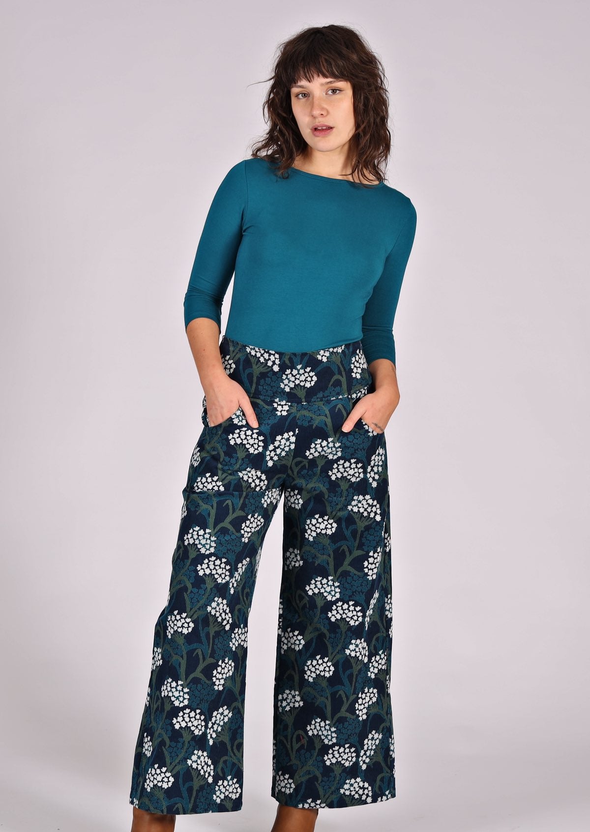 Green and white floral print on blue base cotton corduroy pants