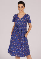 Happy woman wears a 100% cotton dress with no zip and an empire waistline. 