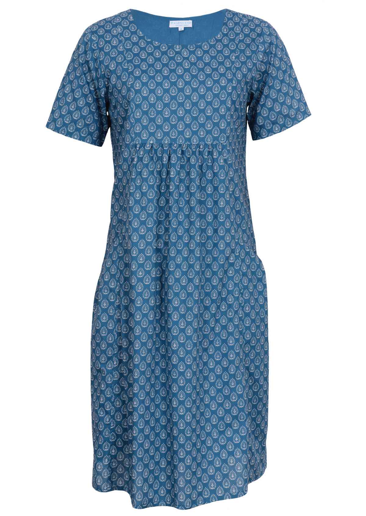 Blue based 100% cotton dress features a square yoke bib. 