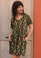 Model wears green and black print cotton dress with pockets