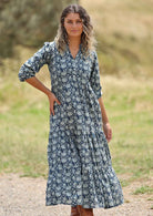 woman with hill in background wearing block print cotton maxi dress in Indigo Blue