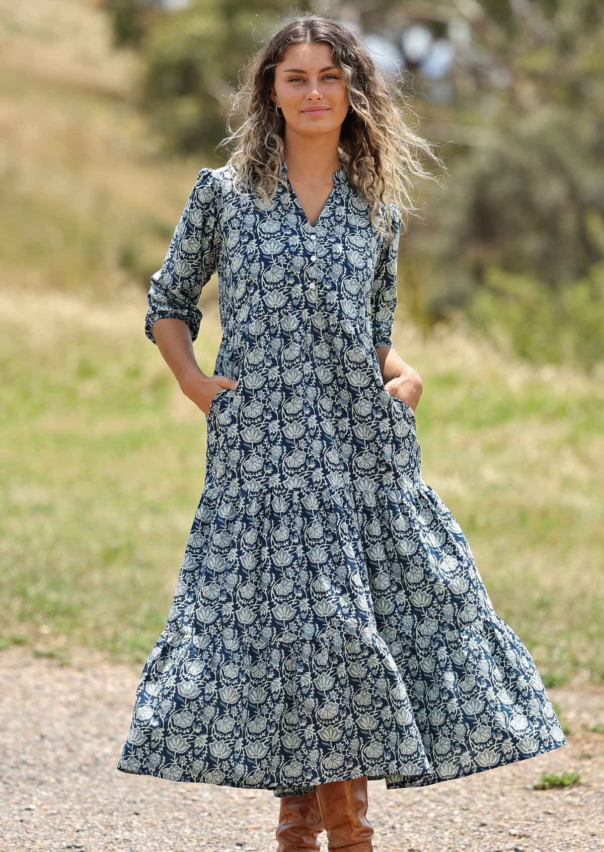woman with hill in background wearing block print cotton maxi dress in Indigo print