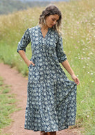 woman with hill in background wearing block print cotton maxi dress in Indigo Blue with hand in pocket