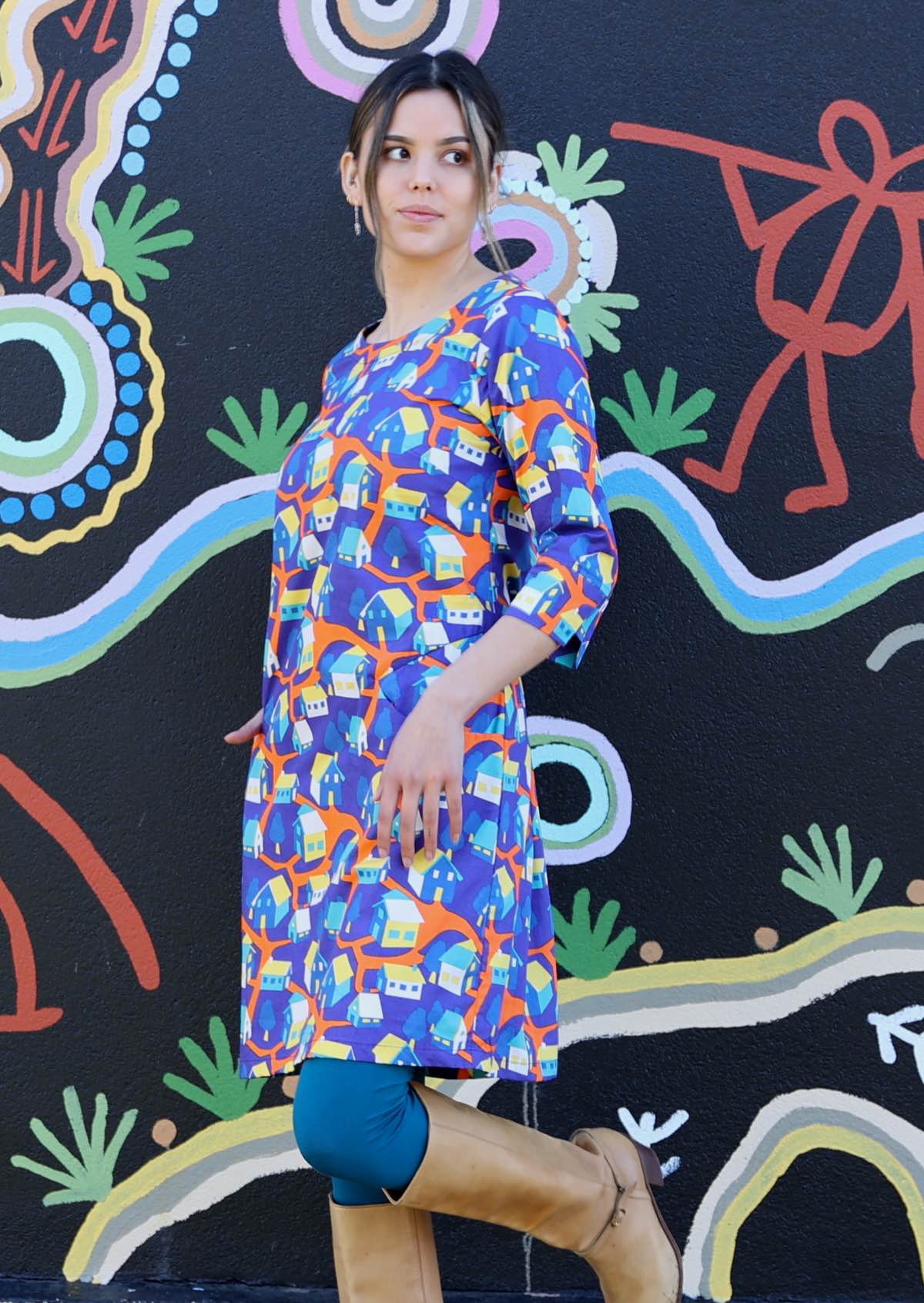 Model in Jamie Dress round neck 3/4 sleeve pockets cotton colourful house print