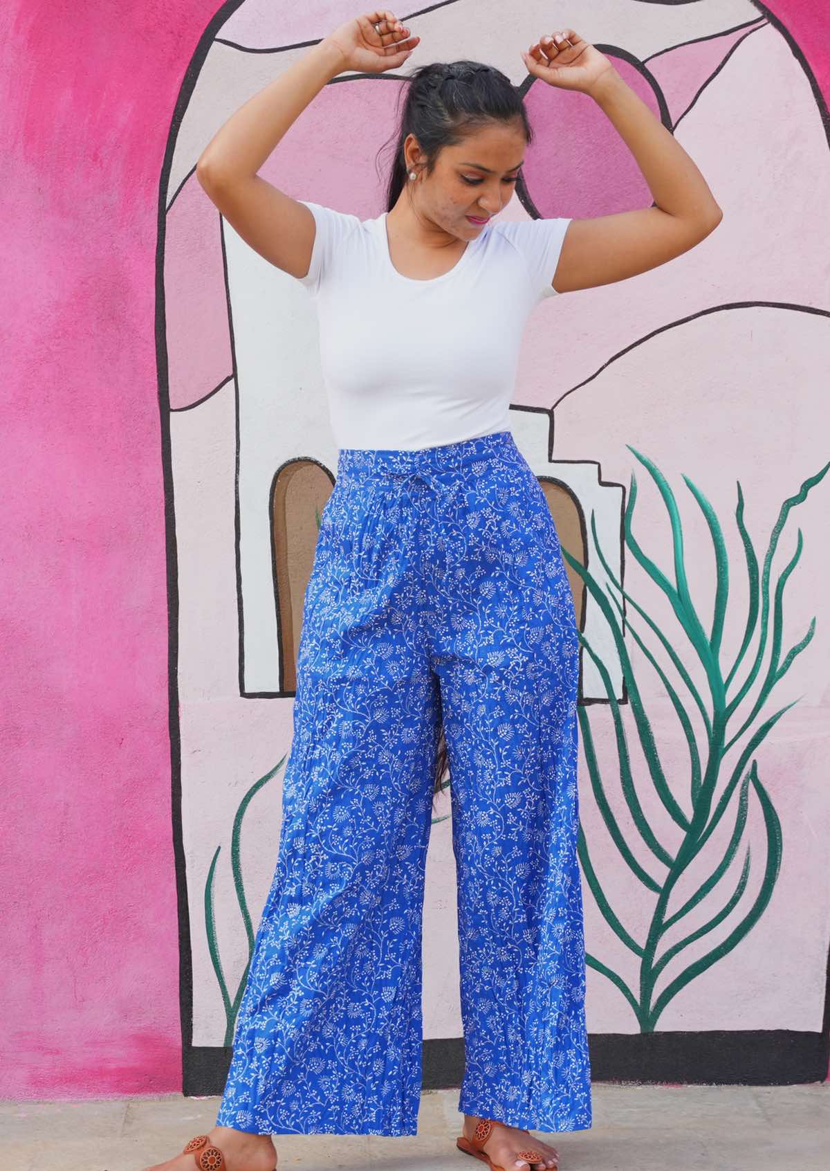 High waisted blue cotton pants with delicate white floral print
