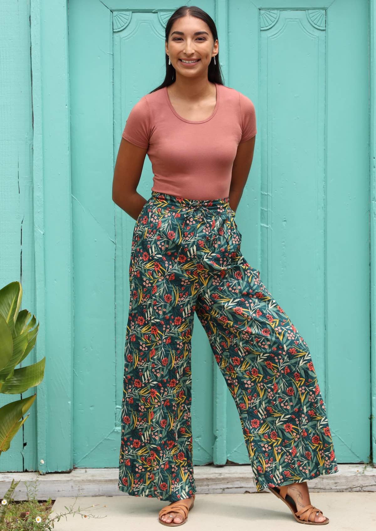 Model wide length pants with an elasticated back waistband. 