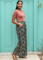 Model wears boho style pants with a drawstring. 