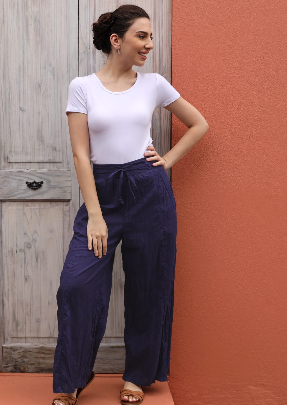 Happy. model wears 100% cotton pants with pockets. 