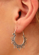 boho sterling silver hoop earrings on woman's ear
