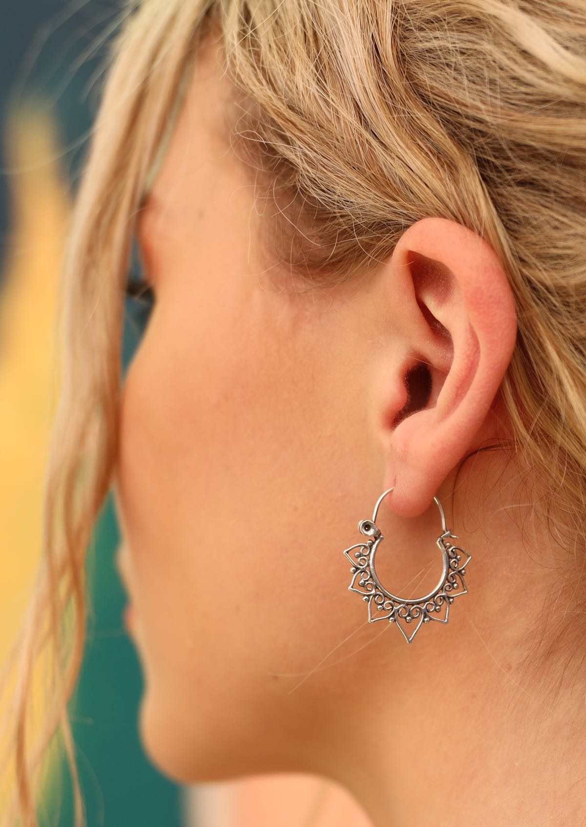 boho sterling silver hoop earrings on blond woman