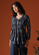 Navy blue Indian block print cotton blouse on model with dark  hair