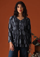 Navy blue Indian block print cotton blouse on model with dark hair and red lipstick
