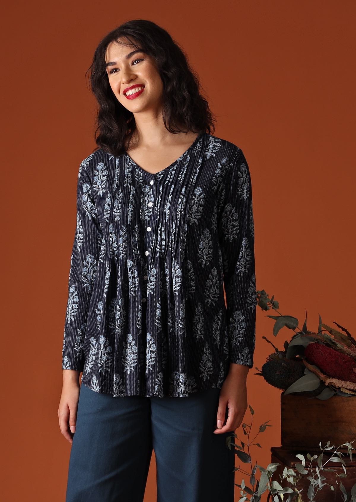 Navy blue Indian block print cotton blouse on model with dark 