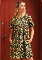 Model wearing cotton botanical print relaxed fit short sleeve dress with pockets 