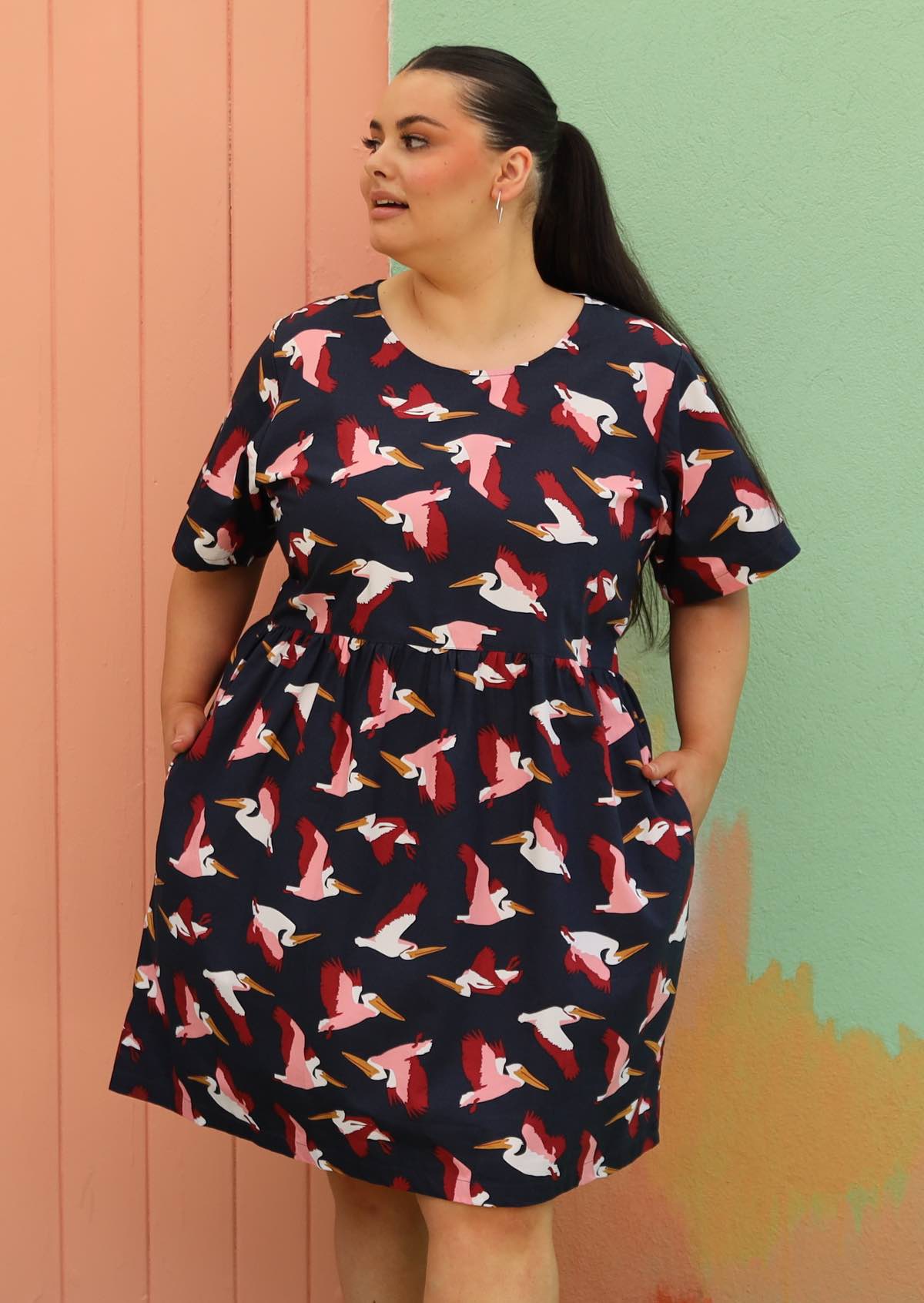 woman wearing plus sized cotton dress above knee with hidden side pockets