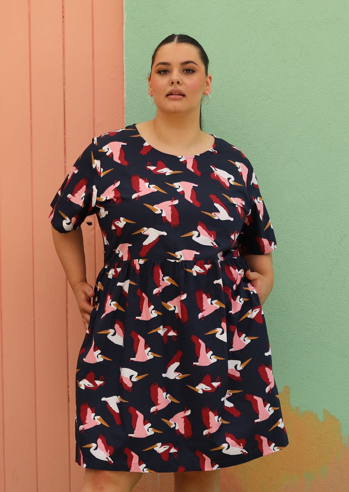 curve woman wearing plus sized cotton dress navy blue with bird print