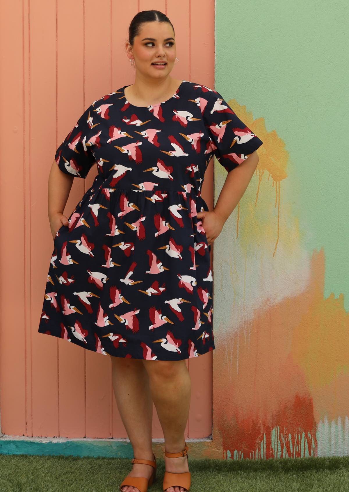 woman wearing plus sized cotton dress navy blue with bird print and cotton