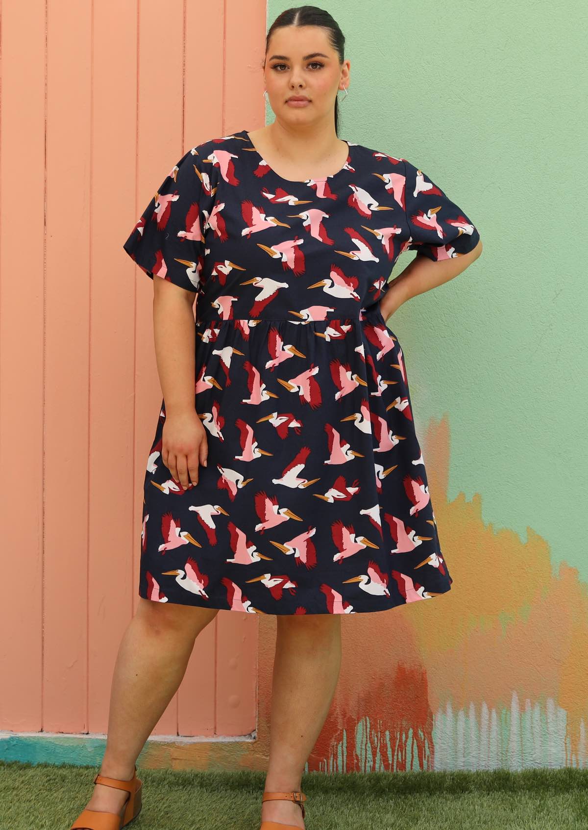 woman wearing size 18 cotton dress navy blue with bird print
