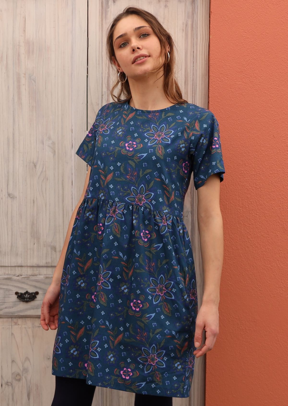 100% cotton dress in blue sits above the knee. 