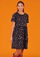 Woman in 100% cotton space print dress with pockets