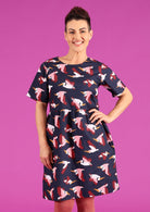 Model wearing short sleeve relaxed fit cotton dress above knee