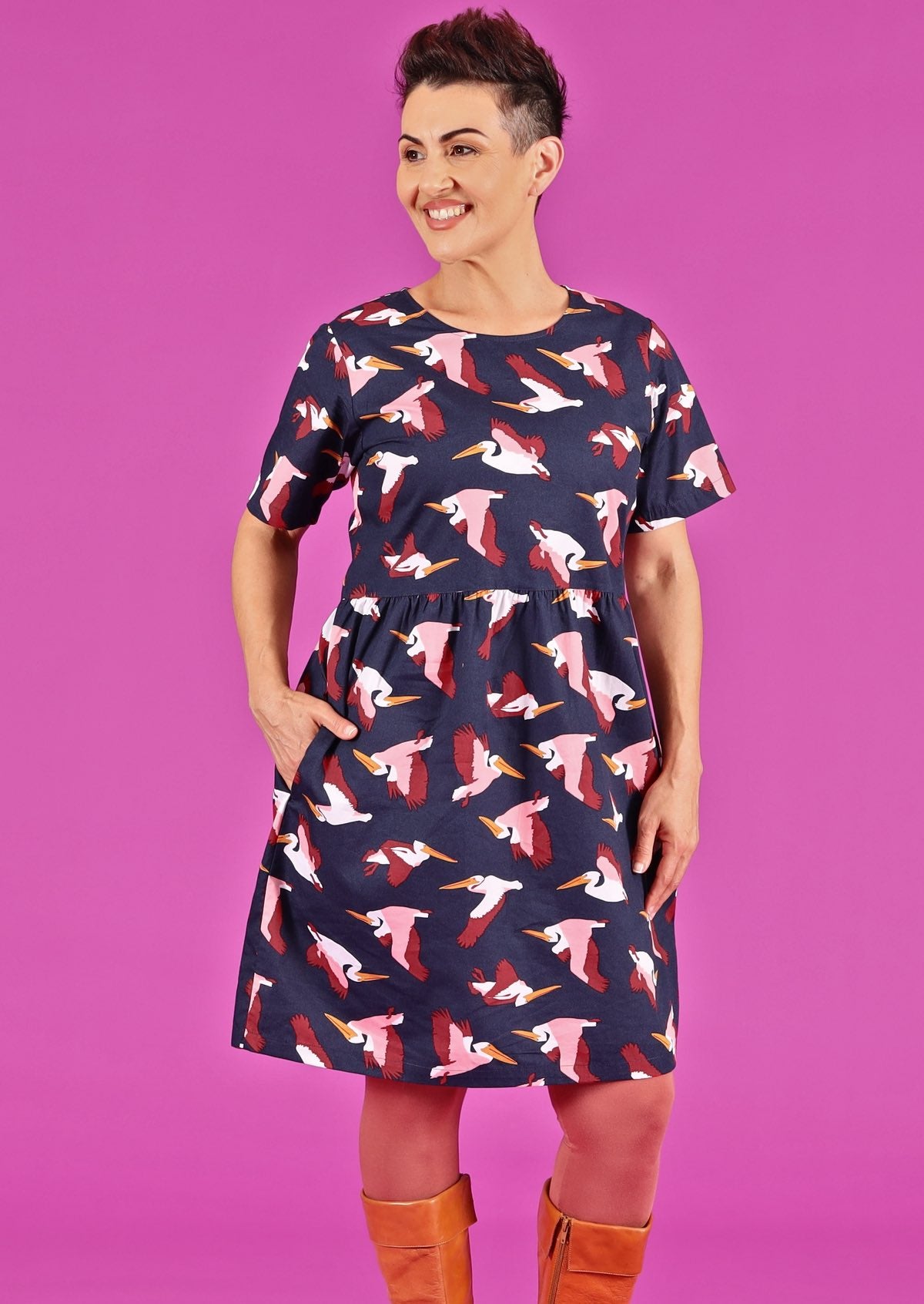 Model wearing flying bird print cotton dress with pockets