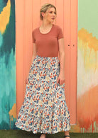 Model wears a 100% cotton maxi skirt with a white base. 