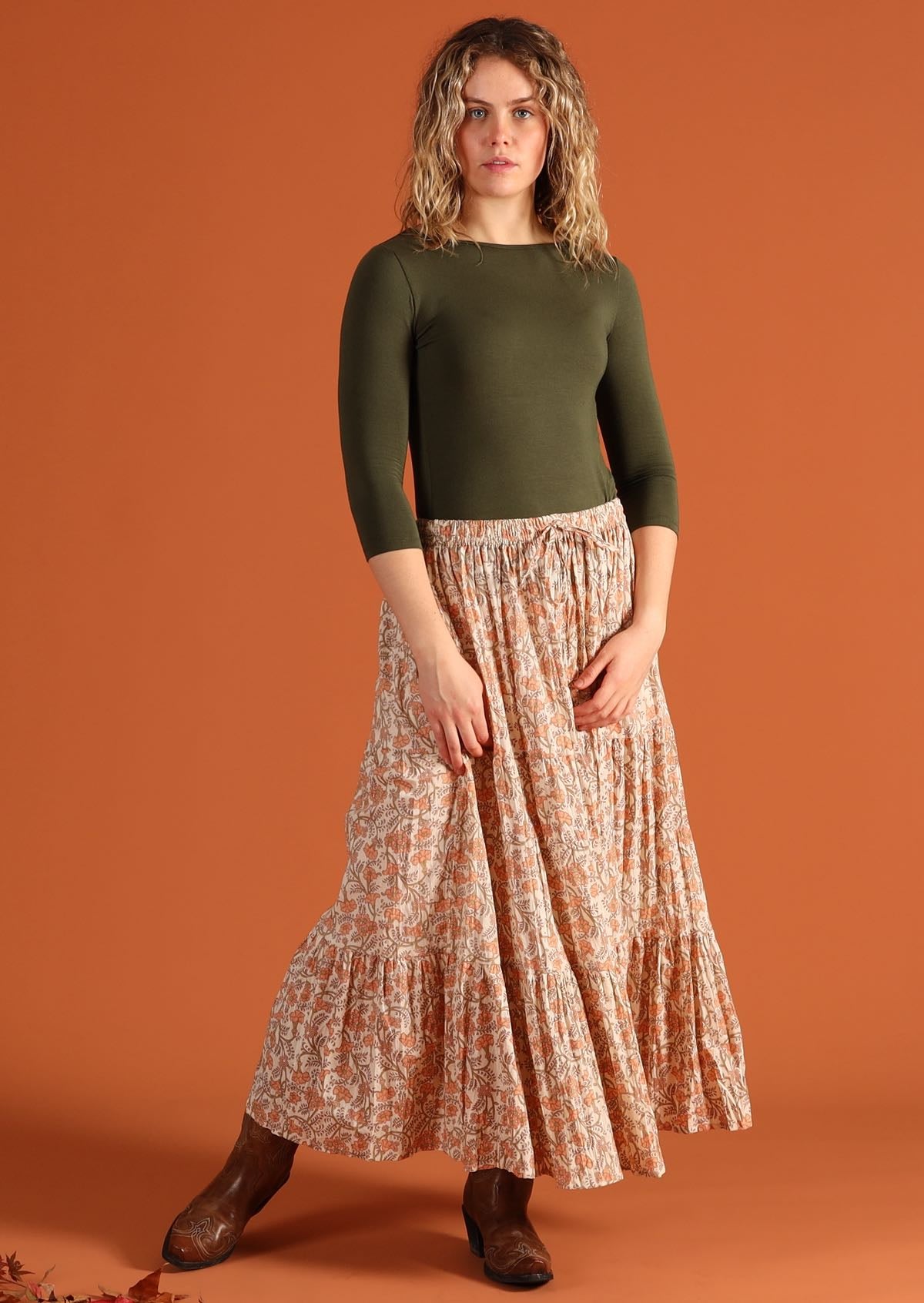 Woman wears 100% cotton peach and beige maxi skirt