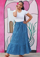 Maxi skirt sits on waist or lower to hips