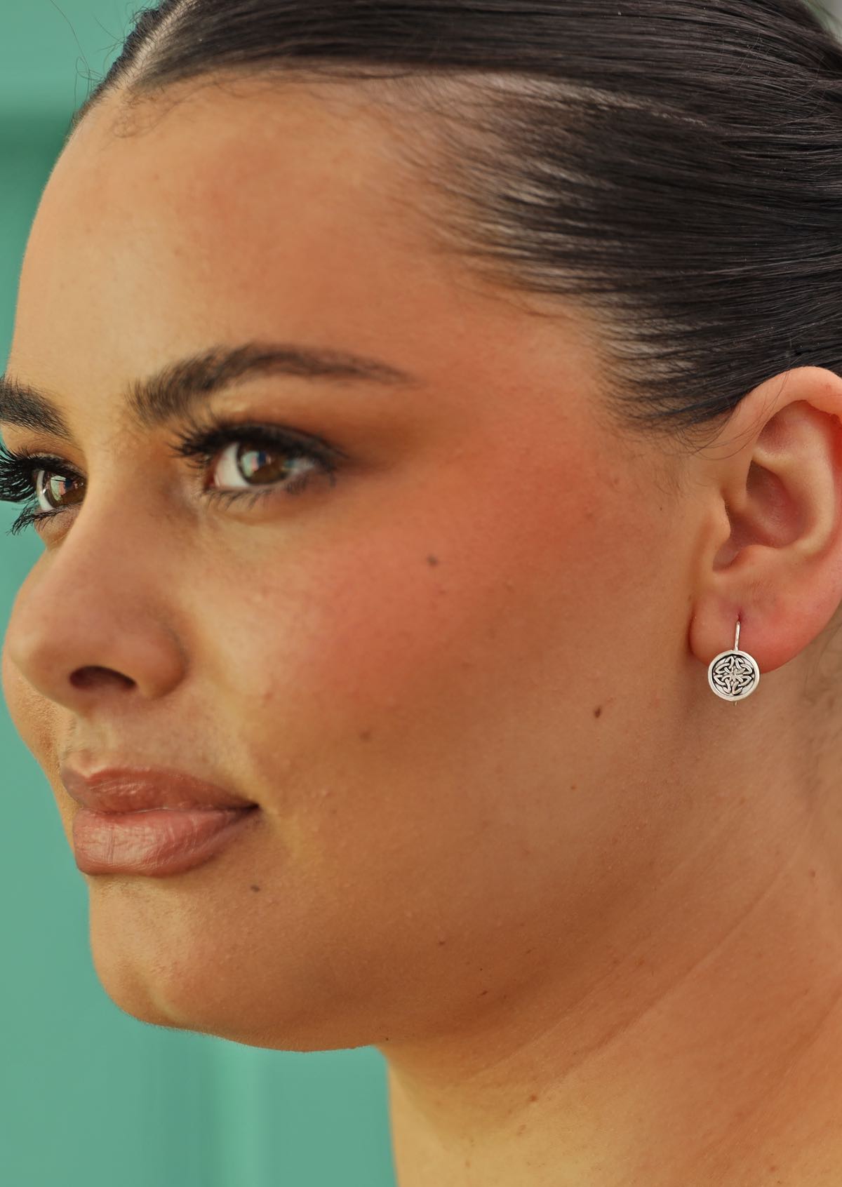 woman wearing small Celtic earrings with hook