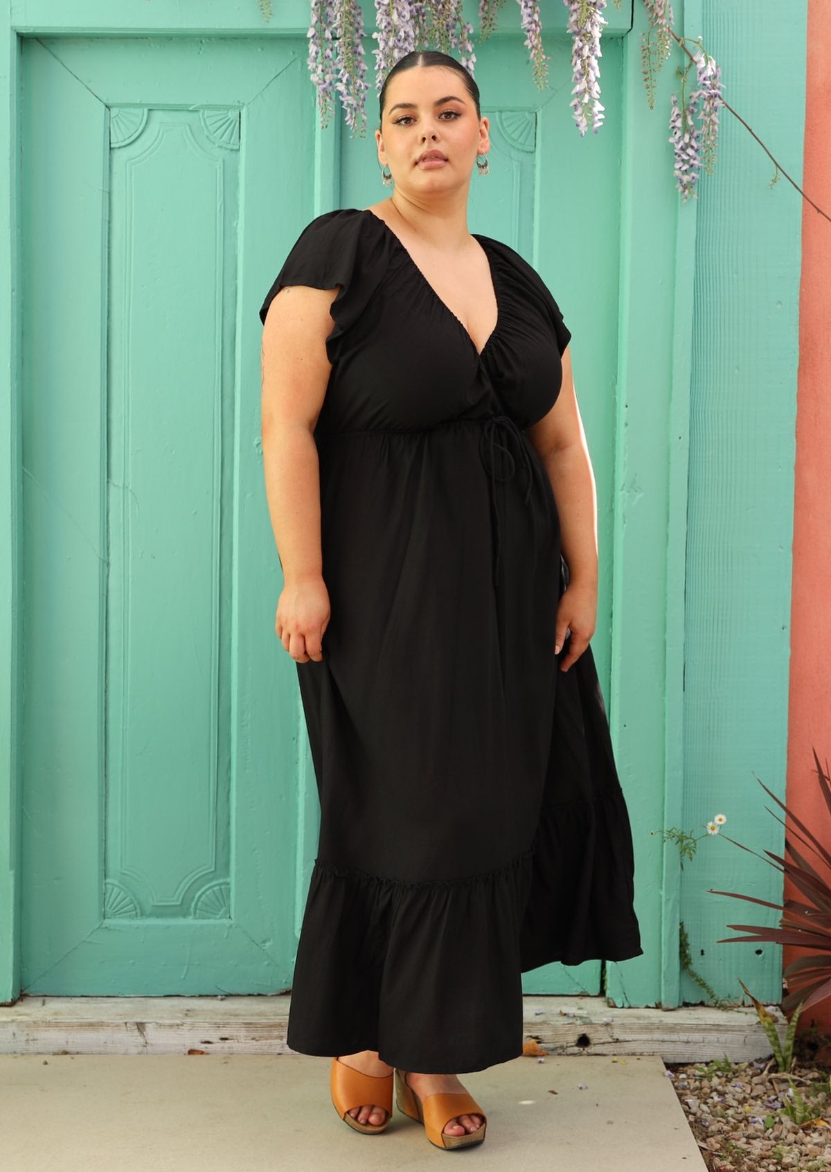 plus sized woman wearing black maxi dress