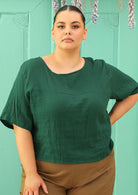 curve sized model wearing double cotton green boxy blouse 
