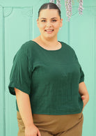 plus sized model wearing double cotton gauze green boxy blouse 