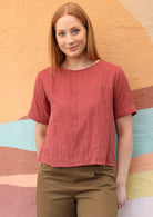 Model wears double cotton top with decorative seam across the bust.