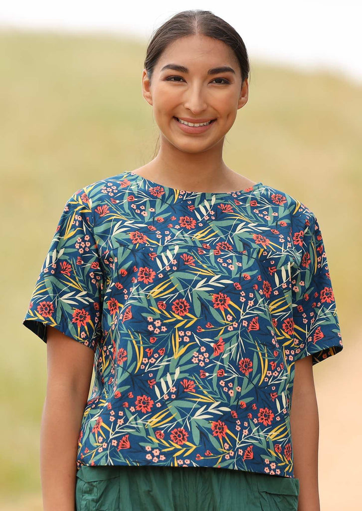 Model wears blue floral print cotton relaxed fit top
