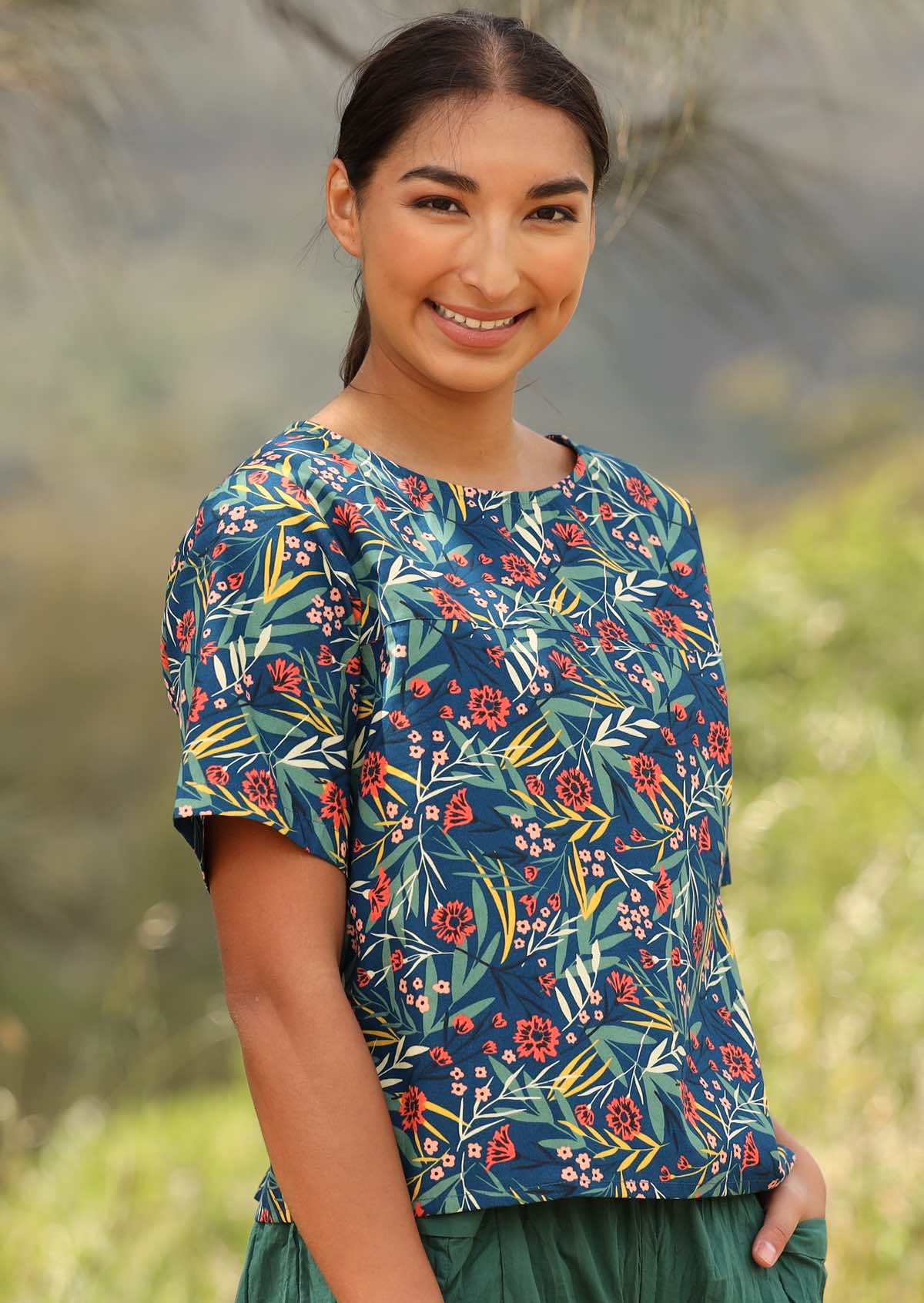Model smiles in cotton floral print relaxed fit short sleeve cottontop