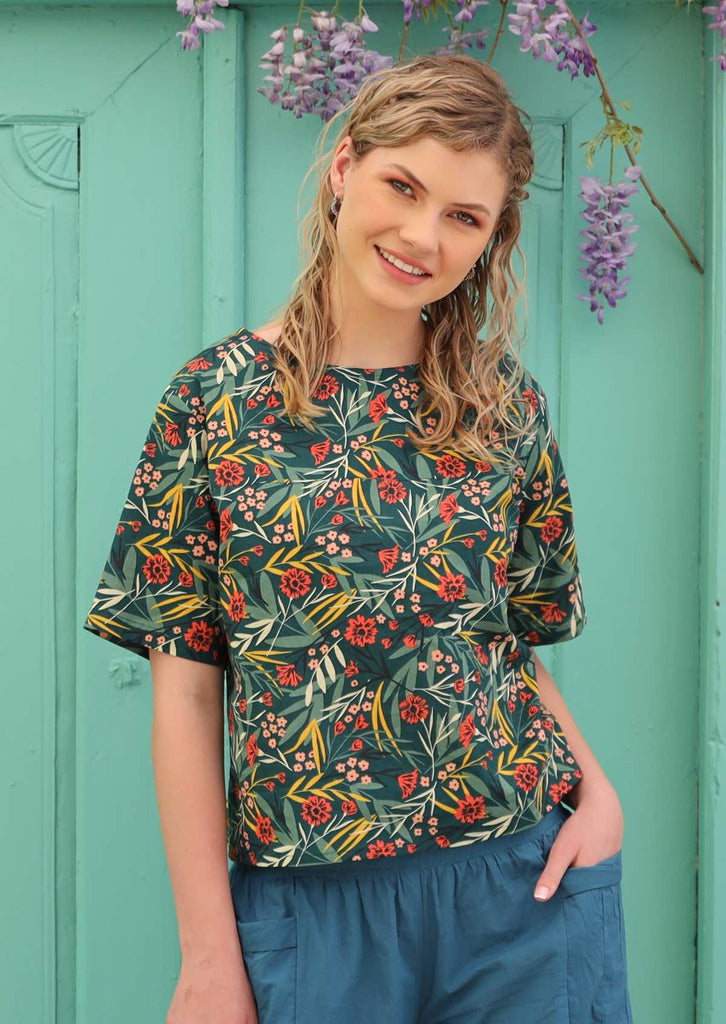 Model wears 100% cotton floral top. 