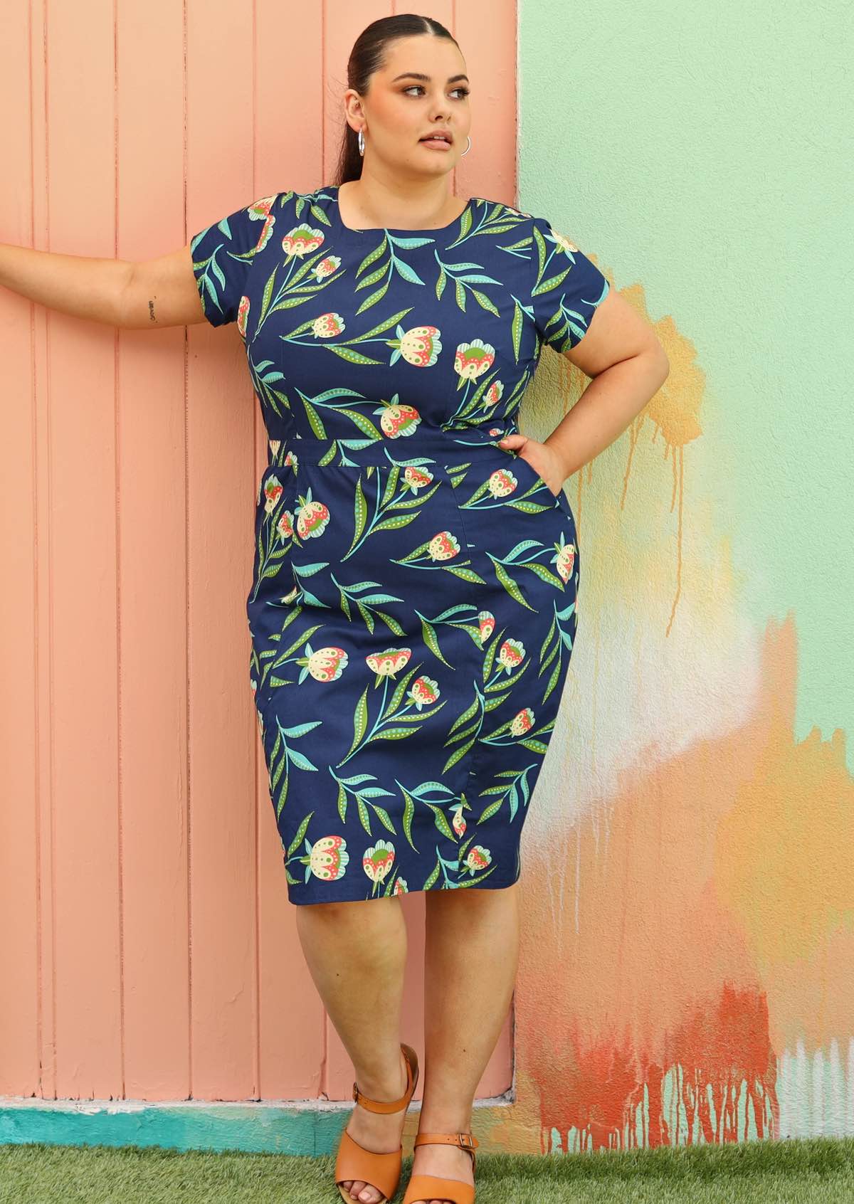 size 18 model wearing flattering cotton dress in navy blue with pockets