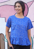 Blue based floral cotton peplum top with short sleeves