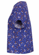 Cotton top in blue has a fun orange and off white daisy print. 